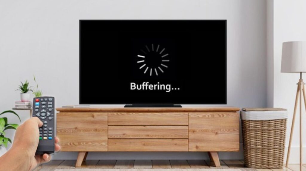 Smart TV screen showing buffering icon in a modern Dubai apartment living room.