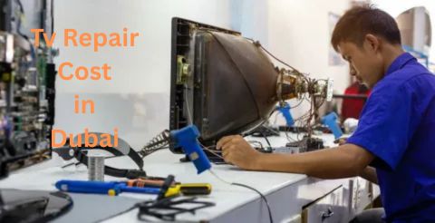 A close-up shot of a technician wearing gloves, using tools to repair the internal components of an older, large-screen television (likely a CRT or early plasma set). The text "TV Repair Cost in Dubai" is overlaid in white.