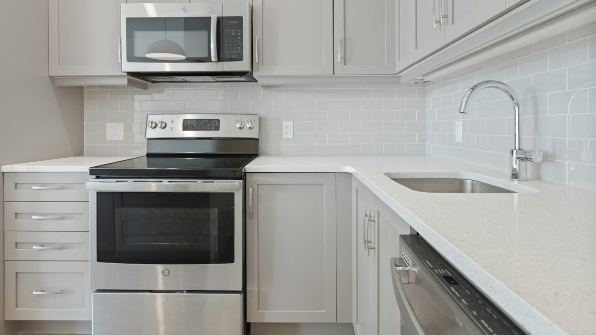 White countertop microwave oven used for the water test to check if the microwave is heating
